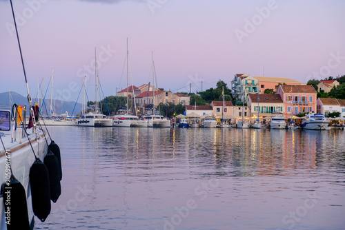 Canvas Print The Harbour of FGiskardo in Kefalonia with yachts and catamarans mooring