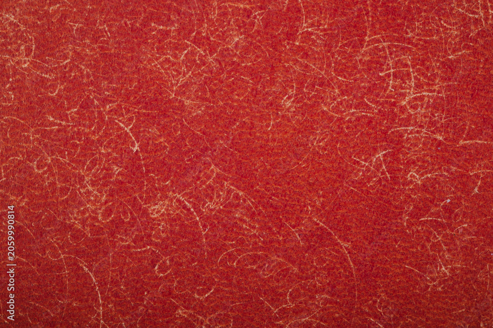 Fototapeta premium Close up texture of red textured paper with abstract swirling line details for backgrounds