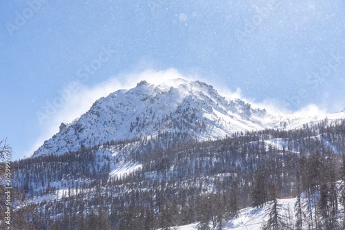 Snow-covered mountain with blue sky