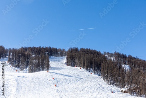 Ski slope with clear blue sky
