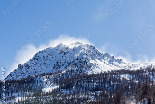 Majestic snowy mountain with clear blue sky