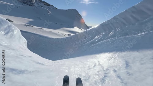 Skiing down a pristine snow-covered slope in a breathtaking mountain landscape. Experience the thrill of winter sports and adventure in nature