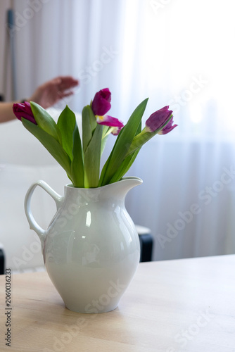 Pink Tulips in a White Jug on a Work Desk, Space for Creative Ideas, Business Setting