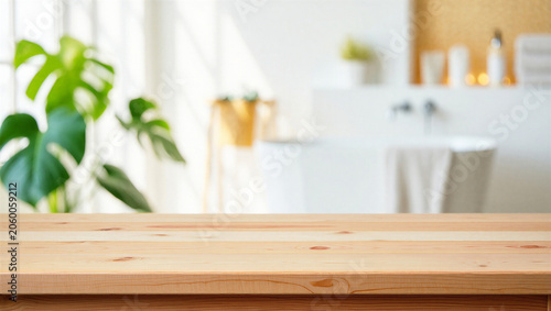 Slika na platnu Light wood tabletop foreground with blurred bright spa bathroom interior and mon