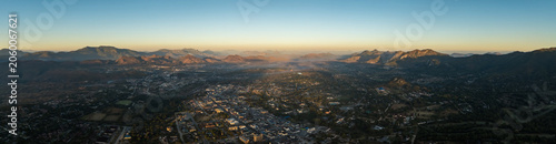 Fotografie Aerial view of Mutare city at sunrise with mountains