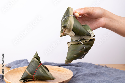 Holding a fresh zongzi in hand