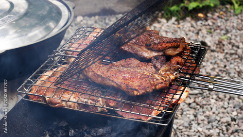 barbecue grill on fire, beef steaks, cooking outside