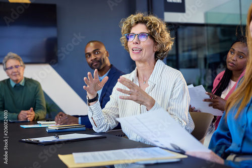 Mature businesswoman talking in a office meeting