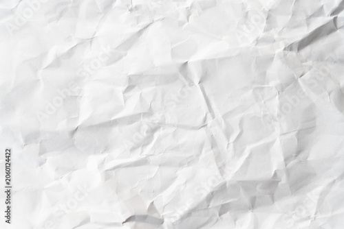 Grunge wrinkled white color paper textured background with copy space. Use for decoration or layer