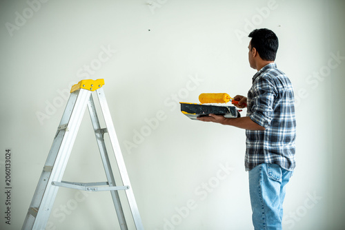 Canvas Print Man painting wall ladder photo