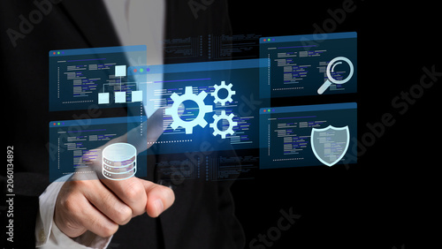 Digital Data Management: A person in a suit uses a touch screen interface to manage digital data, featuring icons for databases, gears, search, and security.