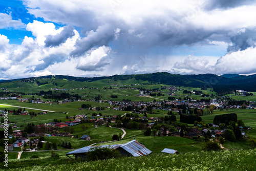 Storm Clouds Over Mountain Village Landscape
