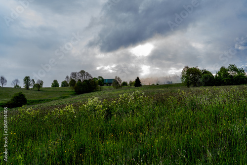 Storm Clouds Over Rural Meadow Landscape