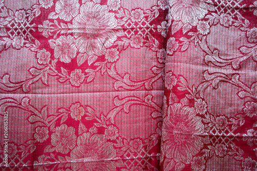 Photos Full frame background texture of luxury red and silver brocade fabric woven with