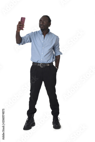 Vászonkép front view of a man taking a self-portrait on white background