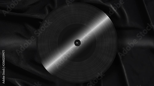 Black Vinyl Record on Dark Fabric with Light Reflection Background