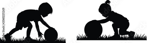 Foto Silhouettes of a young boy and girl playing with a ball on the grass isolated on