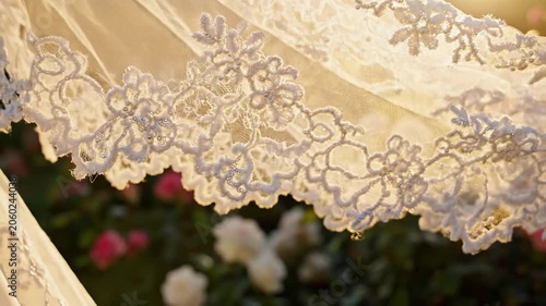 Delicate White Lace Veil With Floral Embroidery In Soft Sunlight