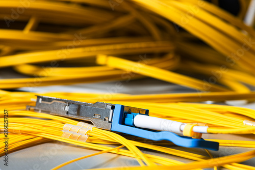 Gigabit interface transceiver module connected to a fiber optic patch cord, telecommunications network components