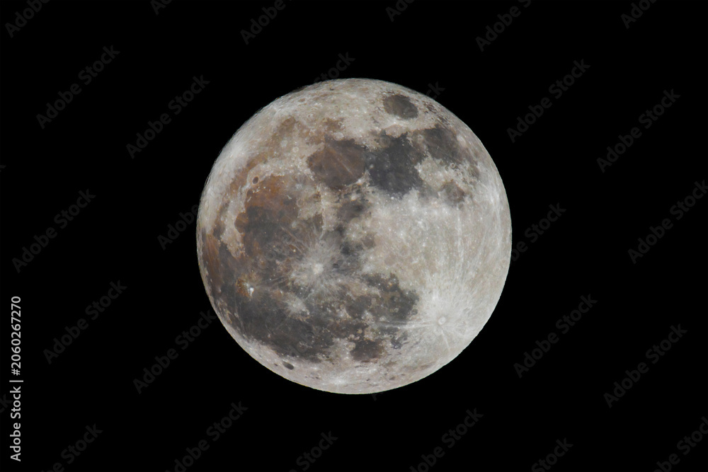 Fototapeta premium full moon with multicolored crater surface in black sky