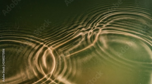 Water ripples on a green background.