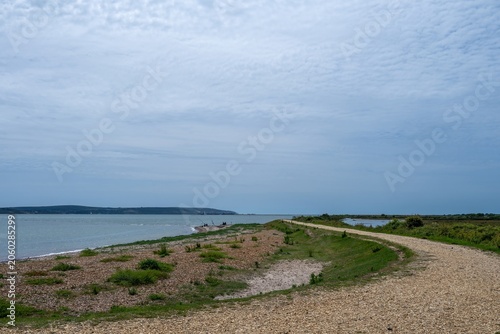 Footpath along The Solent Way trail at Lymington Hampshire England on a summer day