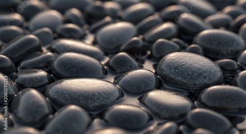 Smooth Black Pebbles Covering Surface in Close Up Natural Texture