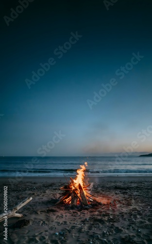 Bonfire on the beach at sunset
