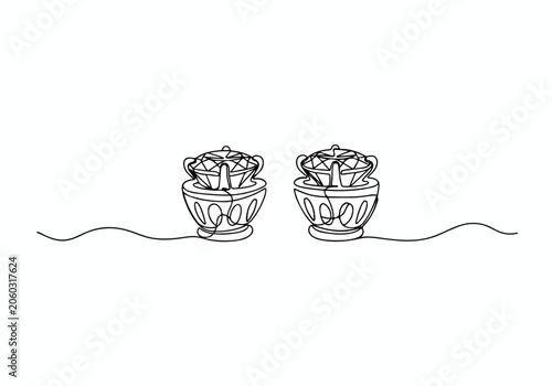 Three Hanging Coconuts With Husks And Fibers.
