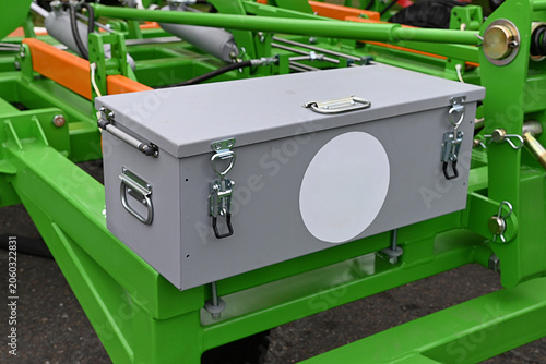 Storage box on a farming machine in a field
