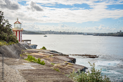 Historic Hornby lighthouse at the entrance of Sydney harbour on a partly cloudy autumn day