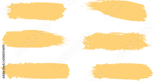 Photos Brushstroke set of yellow paint swatches with textured rough edges isolated