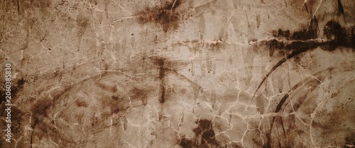 Ancient cave paintings of complex animal shapes on stonetextured brown wall in lascaux suitable for history and art content.