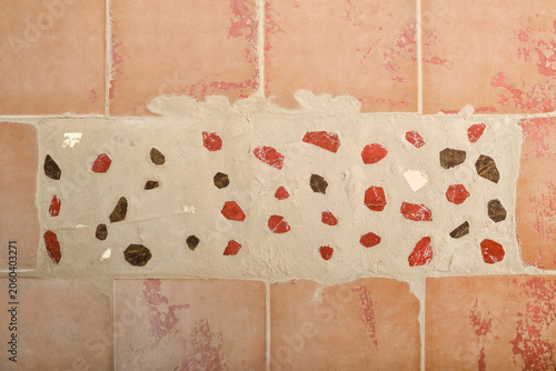 Background of old worn brown tiles with cement