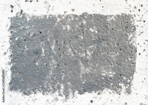 Gray painted rectangle on white concrete wall