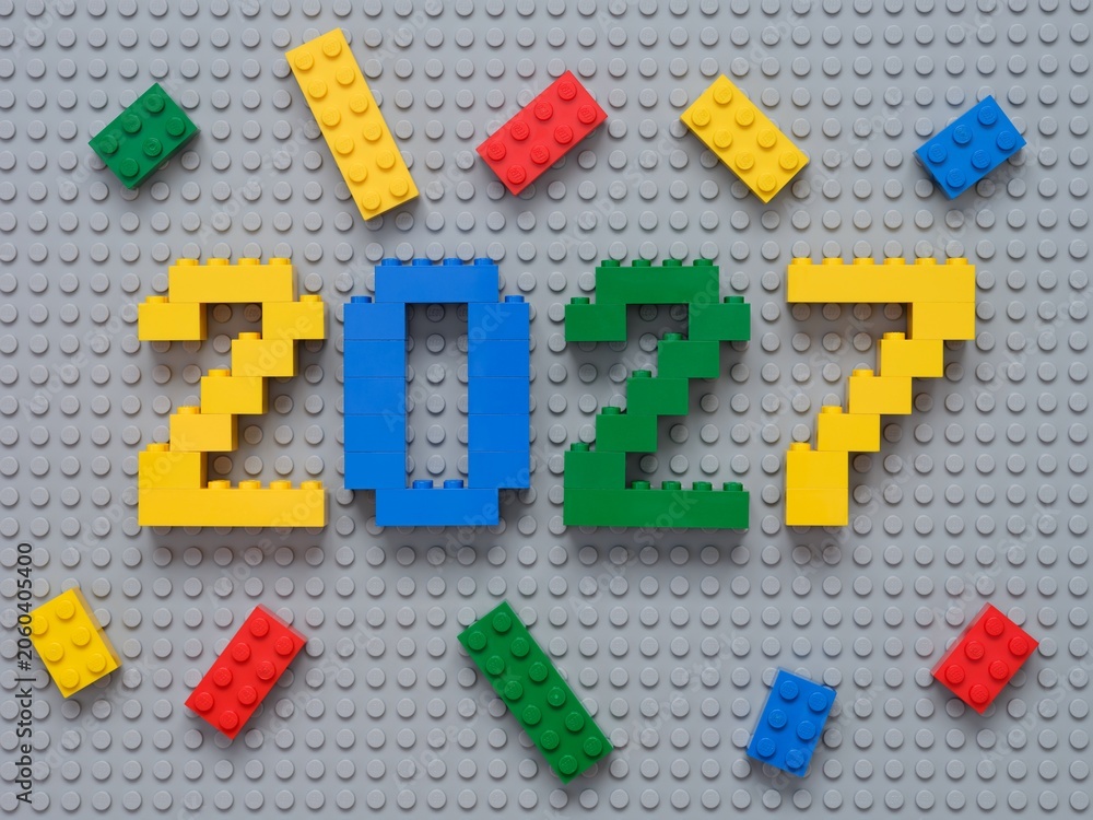 Naklejka premium Tambov, Russian Federation - October 13, 2024 Lego numbers 2027 with some Lego bricks on a gray baseplate background.