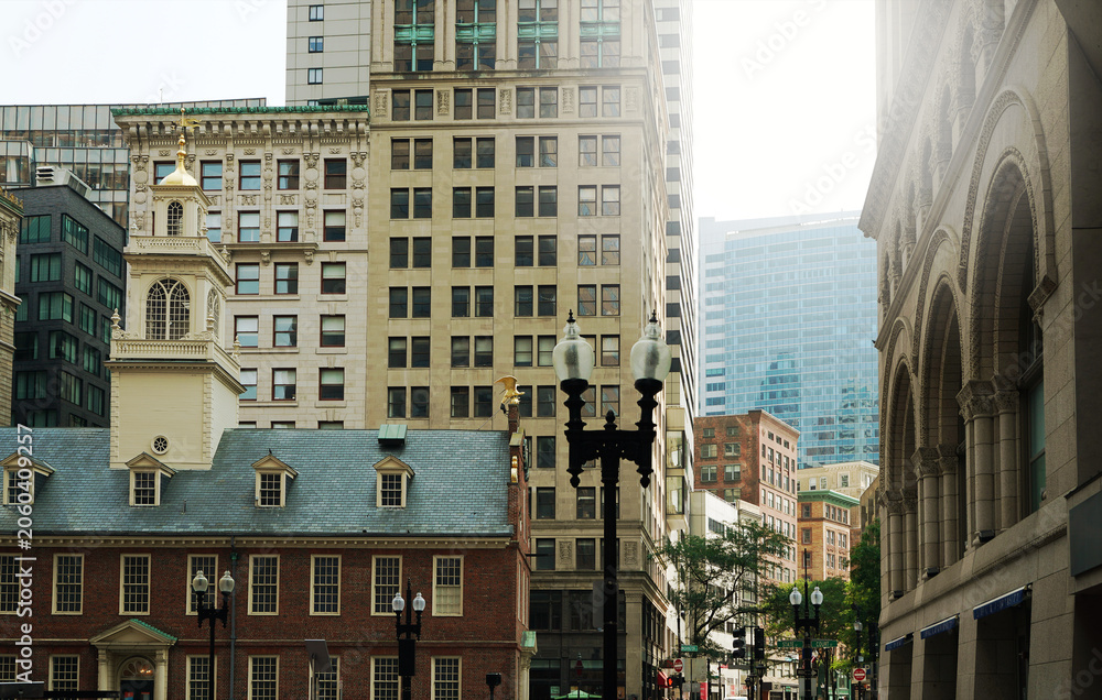 Fototapeta premium The corner of Court and State streets in downtown Boston with the Old State House at lower left