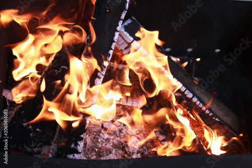 Metal mangal with open fire prepared for outdoor cooking