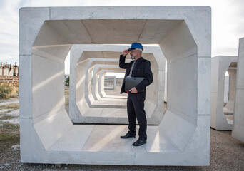 Industrial inspector checks the quality of the concrete structures and frames used for the construction of bridges and aqueducts. Full length..