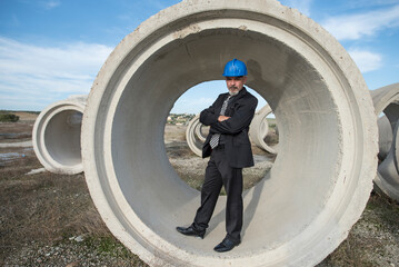 Industrial inspector checks the quality of the concrete structures and frames used for the construction of bridges and aqueducts