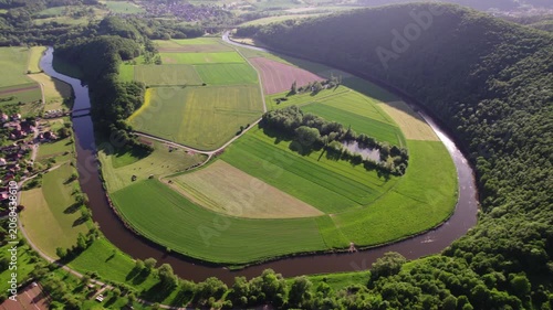 Scenic View Of Winding River And Fields in mountain. Comprehensive Aerial View Of Farmland And River Currents