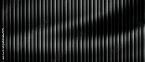 Schilderij op canvas Abstract black metal texture with vertical slats and cinematic lighting