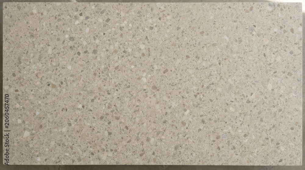 Fototapeta premium Terrazzo stone texture background with a speckled flooring pattern and modern mineral design. This neutral decorative material