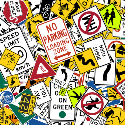 Background of US standard road signs scattered randomly with various shapes ideal as a road education concept or for driving school