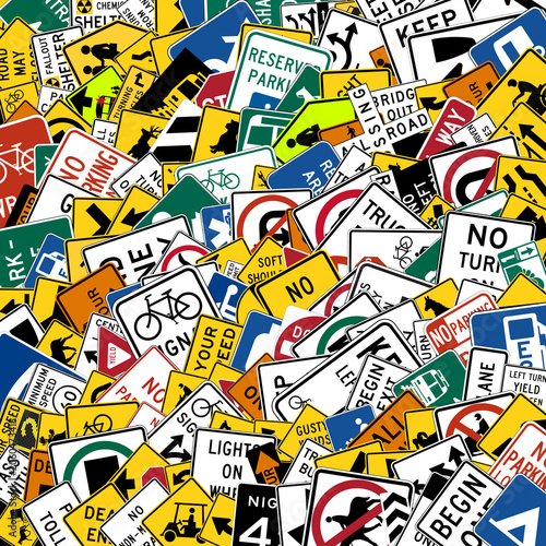 Background of US standard road signs scattered randomly with various shapes ideal as a road education concept or for driving school