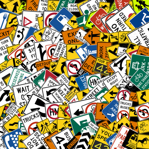 Background of US standard road signs scattered randomly with various shapes ideal as a road education concept or for driving school