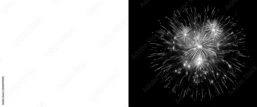 Fototapeta premium Monochrome fireworks explosion on black background, white pyrotechnic burst with light trails, festive firework display for celebration