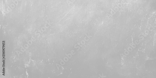 Foto Gray concrete wall texture background with subtle scratches and weathered cement surface for industrial design