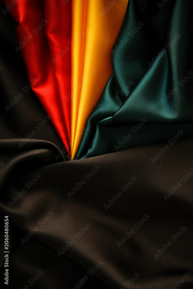 Obraz premium Black History Month background. Red, yellow, green black silk background
