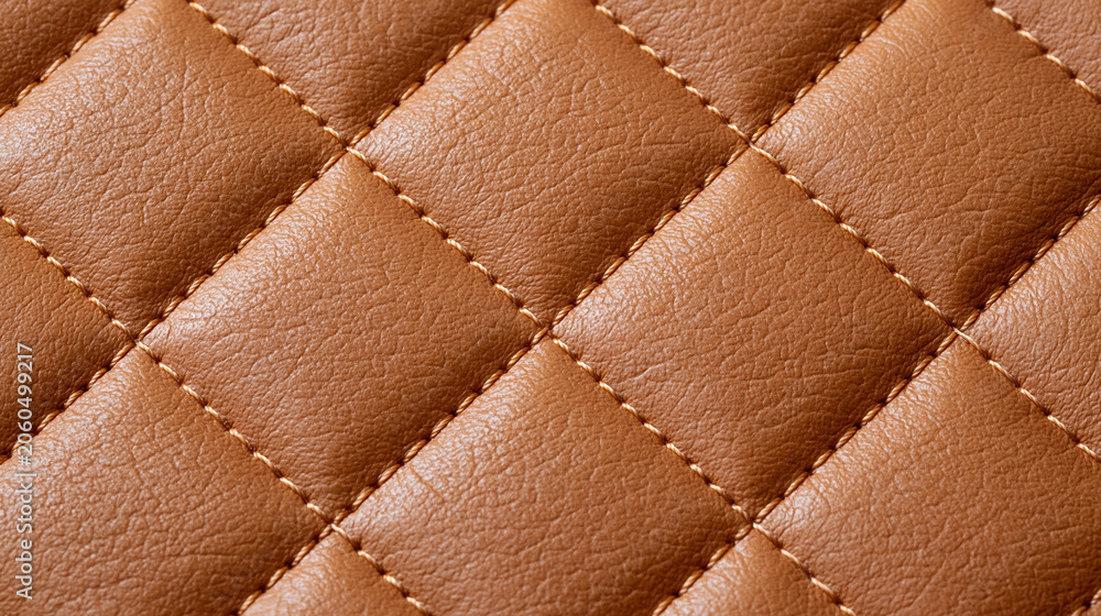 Naklejka premium Premium brown quilted leather texture with detailed stitching and padded upholstery construction